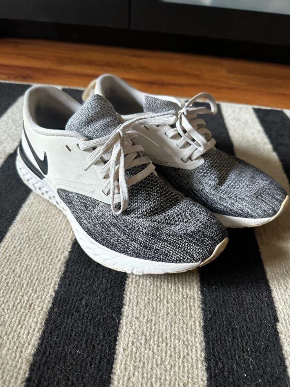 Nike Women’s Gray and White Flyknit Athletic Sneakers
